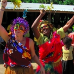 Volunteer taking part in a festival with local dress